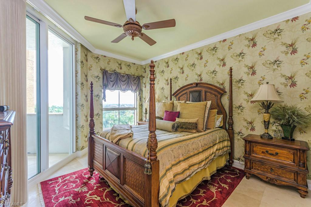 295 Grande Way, Unit 503 Naples, FL 34110 - Photo 11 of 24 a bed room with a bed and a window