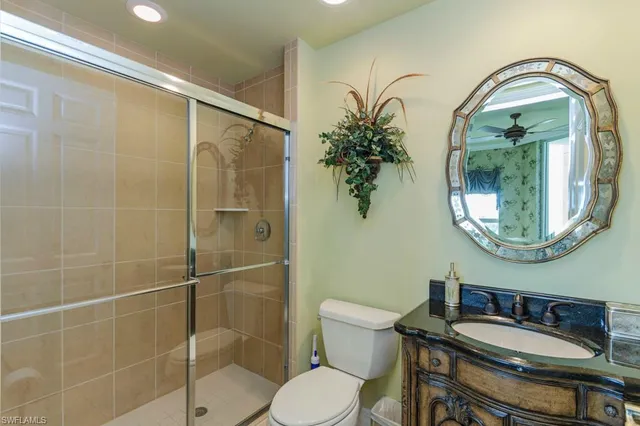 a bathroom with a sink toilet and a mirror