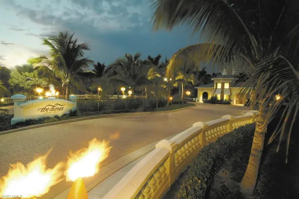 a view of a swimming pool with an outdoor space and seating area