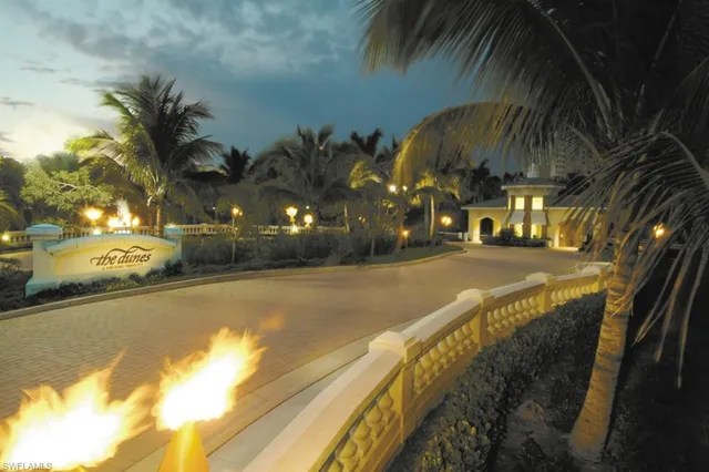 a view of a swimming pool with an outdoor space and seating area