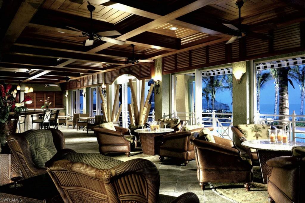 295 Grande Way, Unit 503 Naples, FL 34110 - Photo 20 of 24 a view of a livingroom with furniture and a table