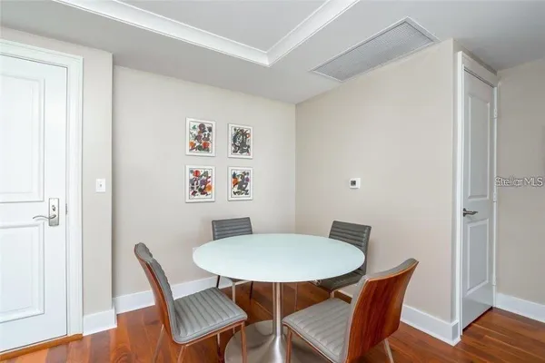 a view of a dining room with furniture and wooden floor
