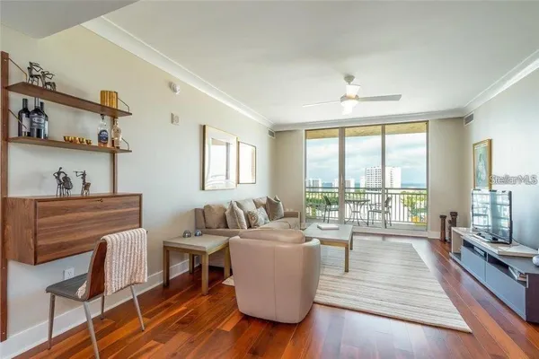 a living room with furniture and a large window