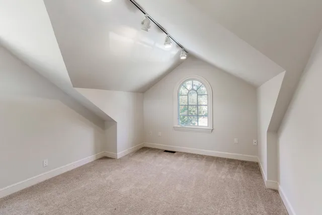 an empty room with windows and windows