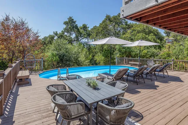 an outdoor space with furniture and umbrella