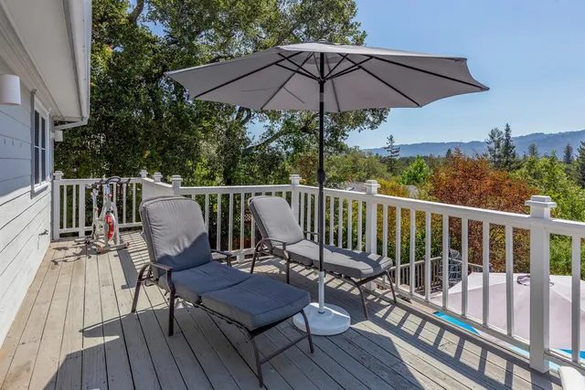 a view of deck with furniture and wooden deck