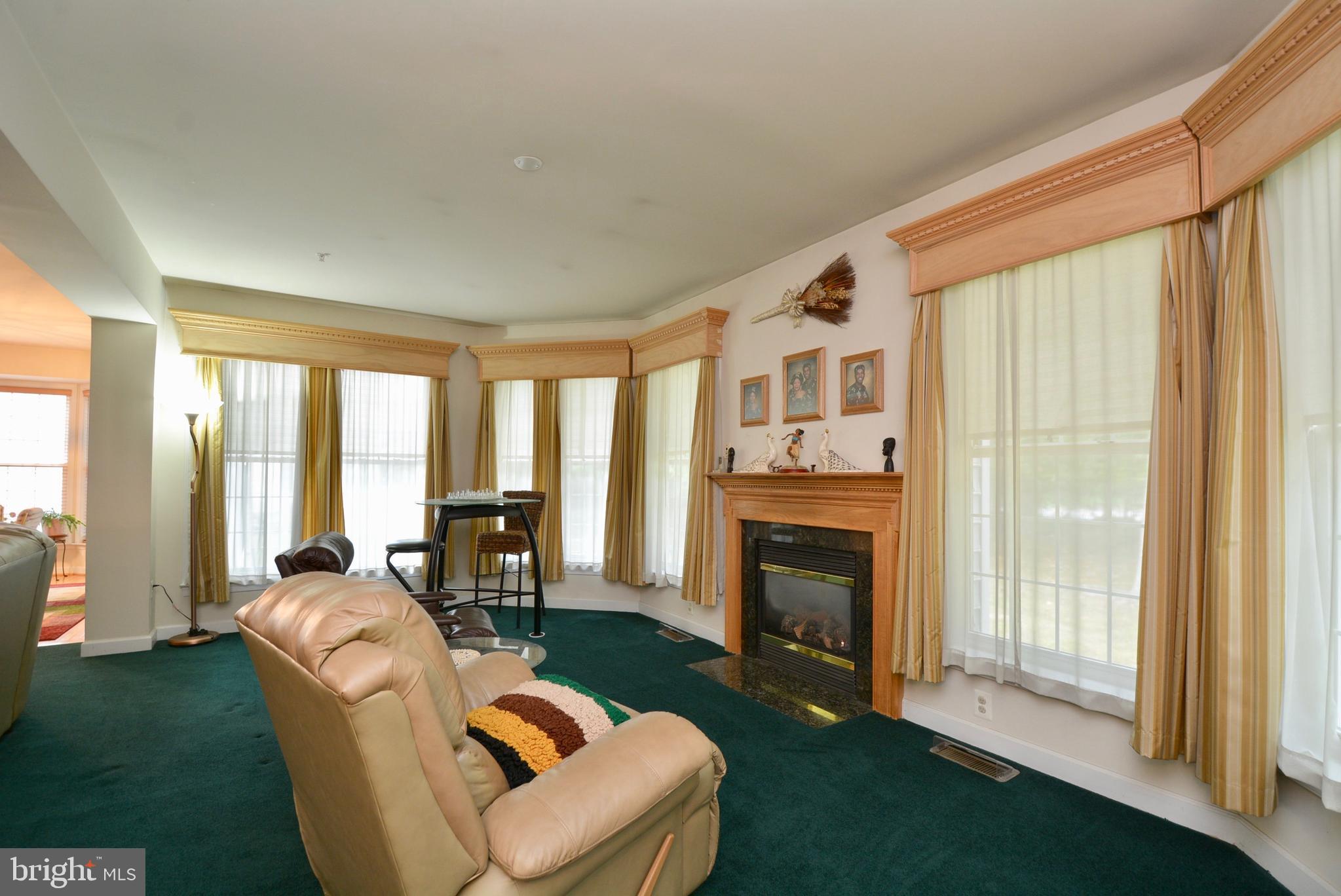 6306 Rory Court Lanham, MD 20706 - Photo 14 of 42 Sunroom with fireplace