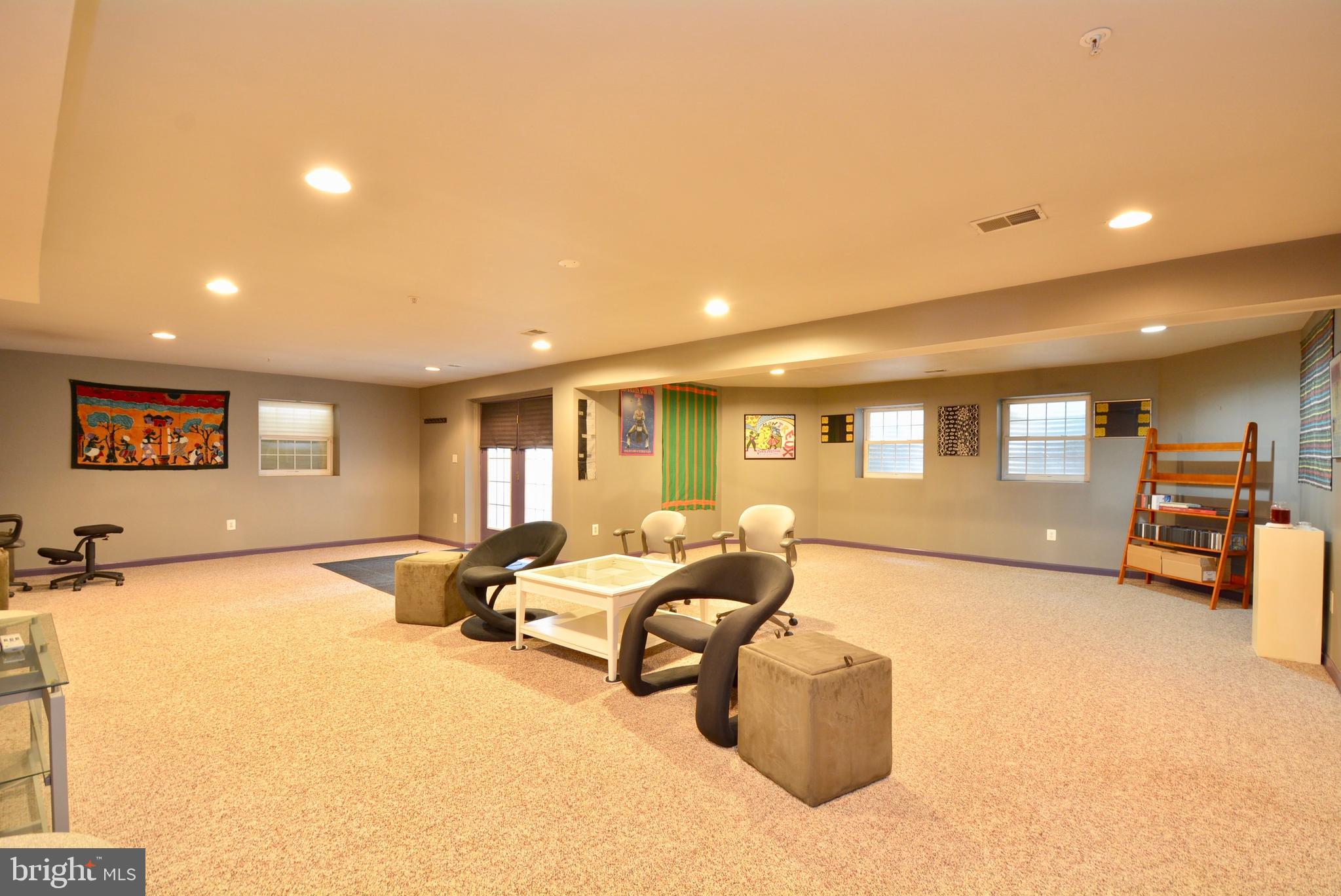 6306 Rory Court Lanham, MD 20706 - Photo 35 of 42 Lower level rec room w/English basement windows