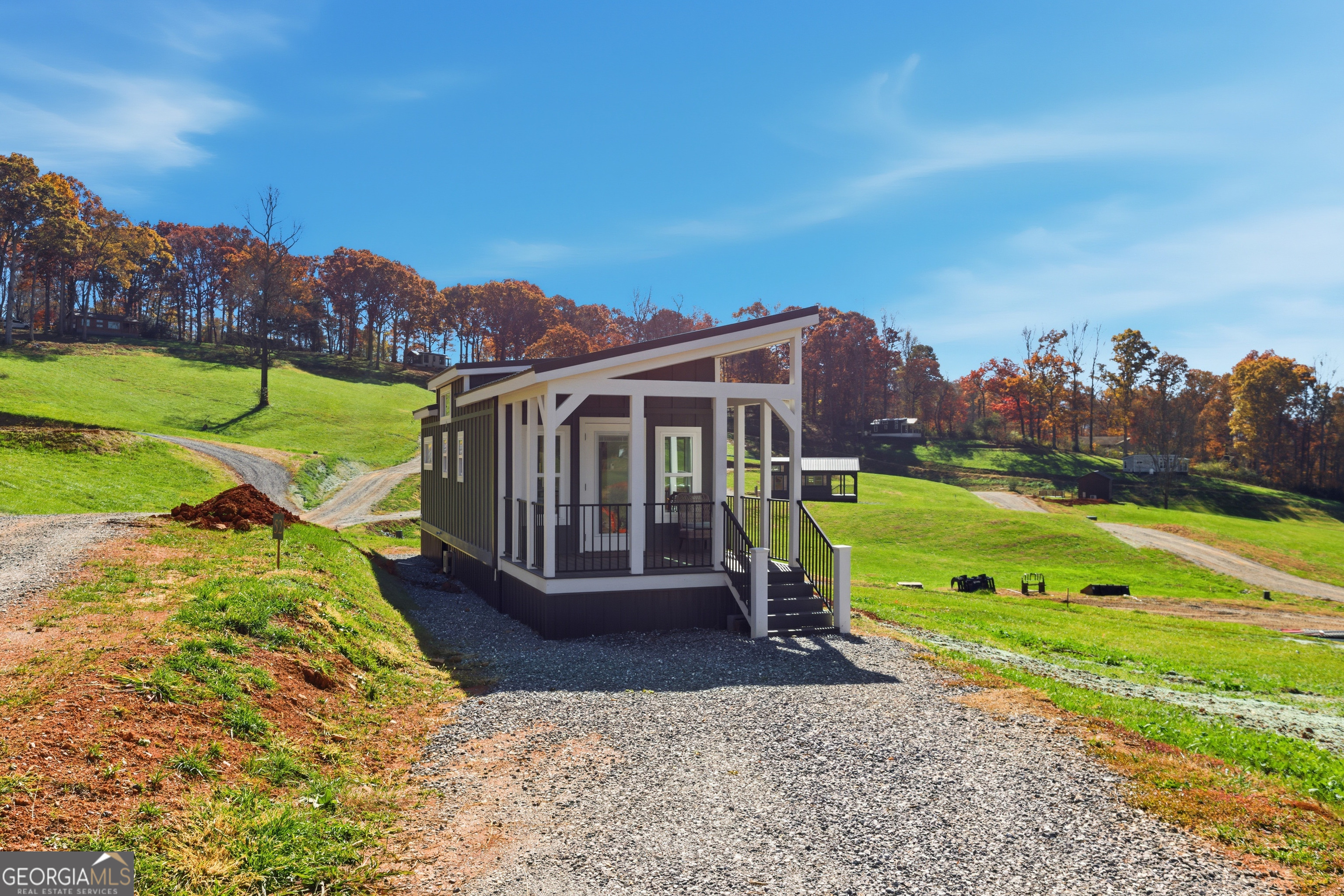 527 Saunders Road Franklin, NC 28734 - Photo 2 of 22 a view of a house with a yard and a park