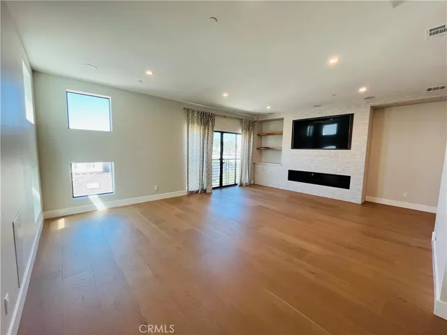 a kitchen with stainless steel appliances a stove a sink and a refrigerator