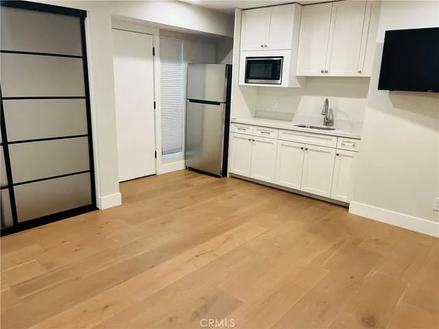 a bathroom with a toilet sink and a mirror
