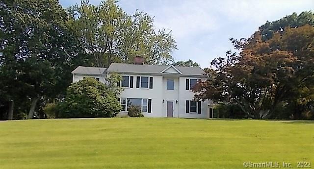 2 Sunset Ridge Danbury, CT 06811 - Photo 1 of 1 a front view of a house with a yard
