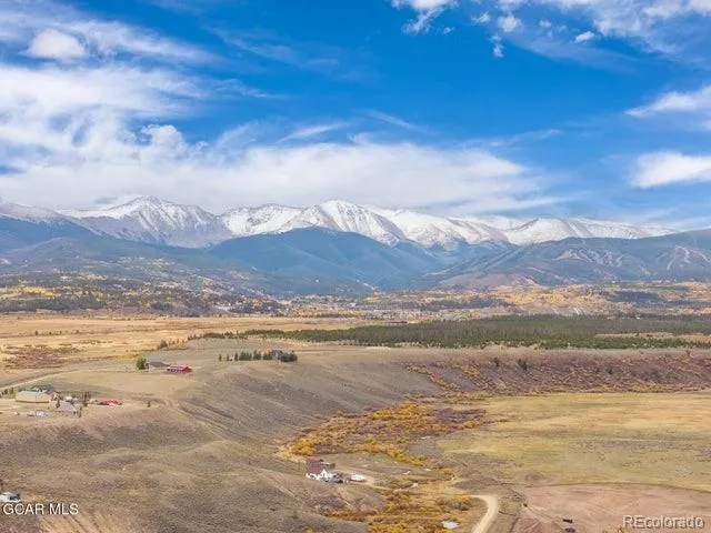 a view of an ocean and a mountain