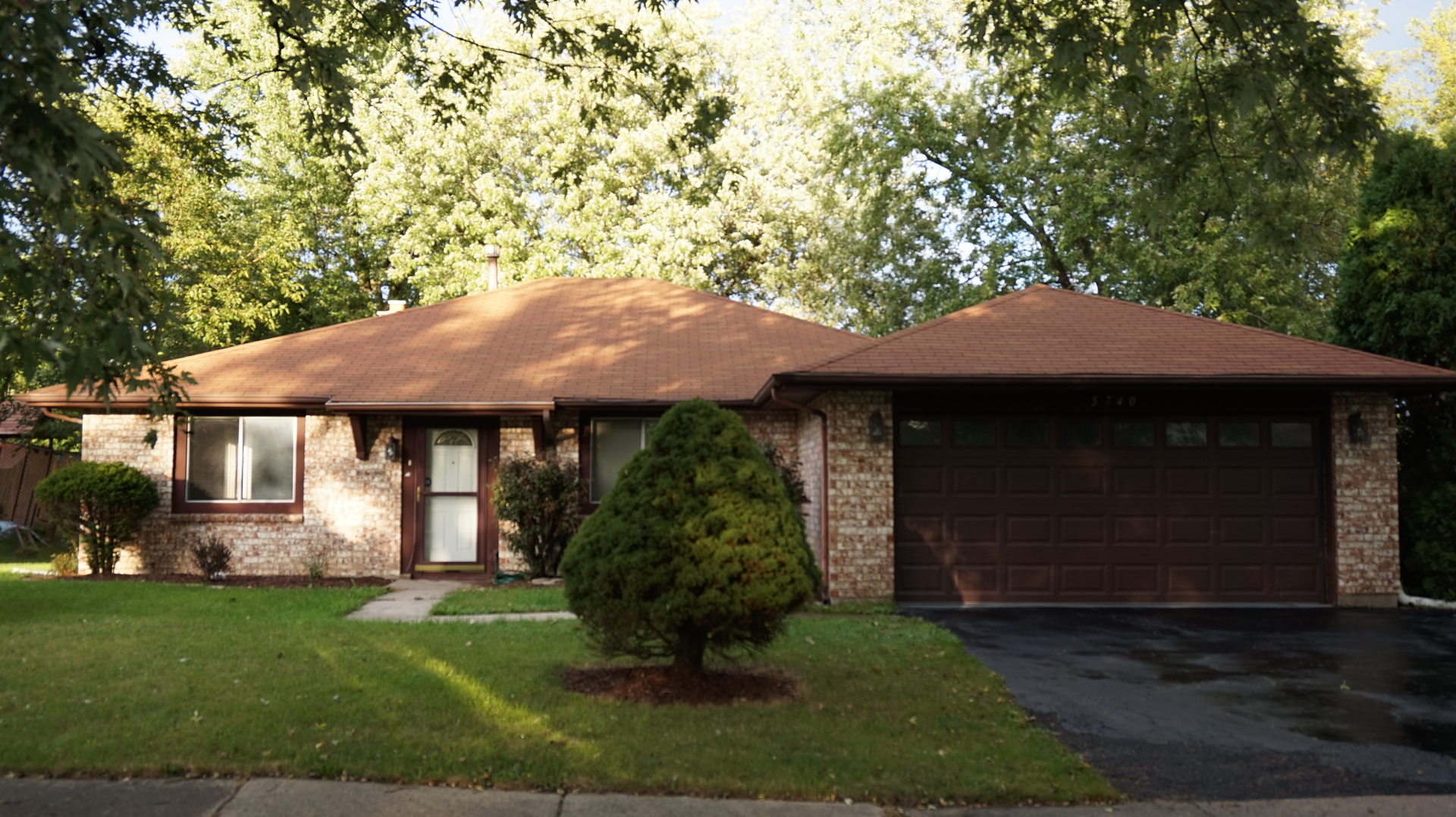 5740 Timberlane Road Matteson, IL 60443 - Photo 1 of 17 a front view of a house with garden