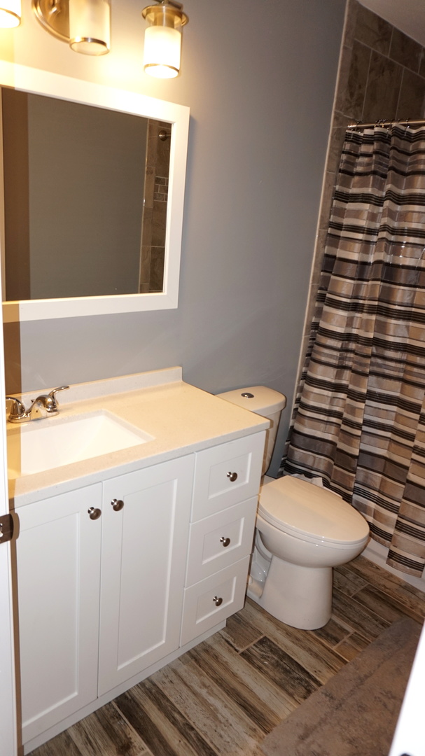 5740 Timberlane Road Matteson, IL 60443 - Photo 15 of 17 a bathroom with a sink and a toilet