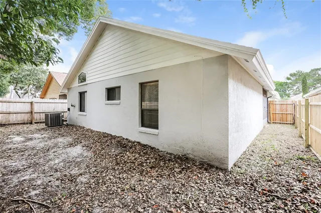a picture of a bench in front of a wall