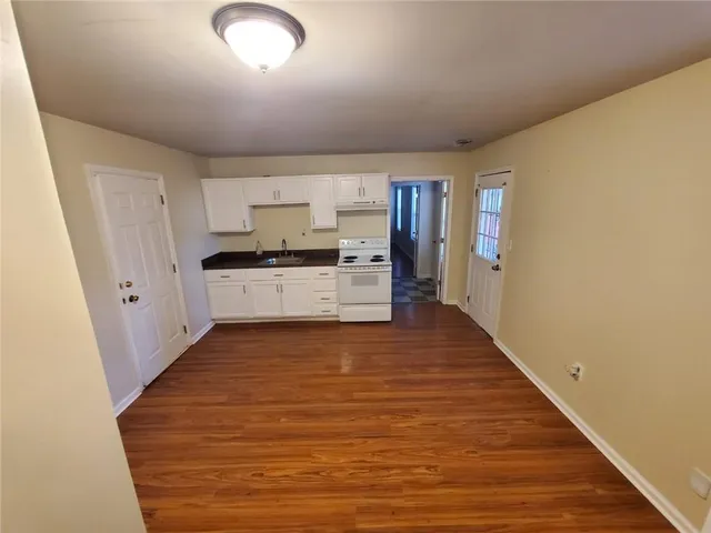 a kitchen with stainless steel appliances a refrigerator and a stove