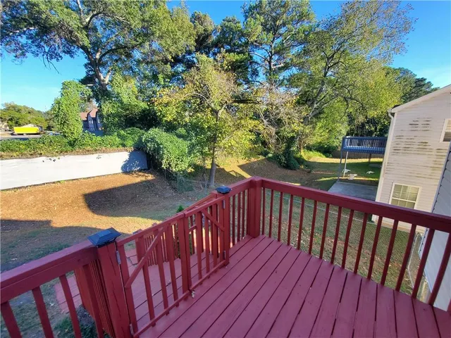 a view of a balcony with wooden floor