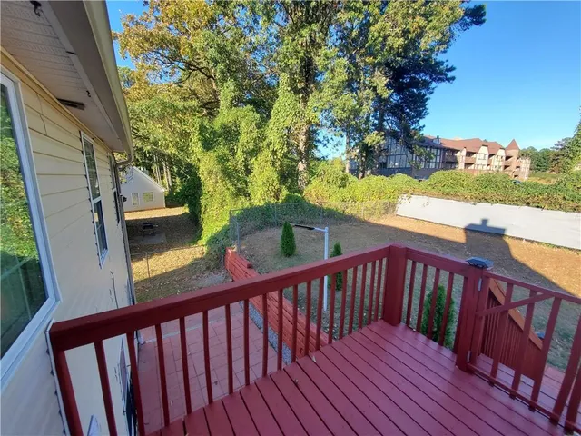 a view of a balcony with wooden floor
