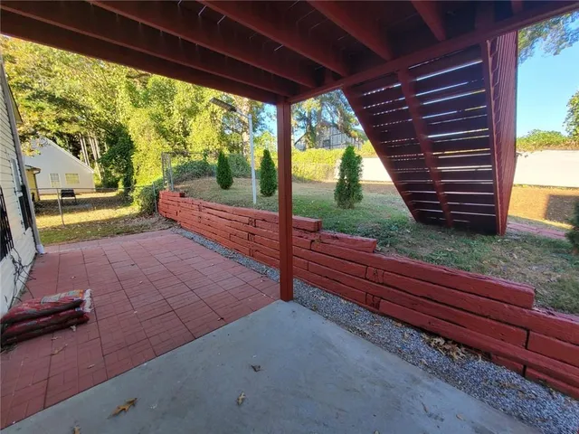 a view of backyard with green space
