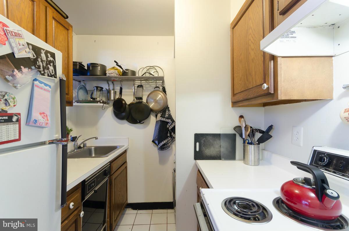 2008 16th Street Northwest, Unit 302 Washington, DC 20009 - Photo 5 of 11 a kitchen with a refrigerator and a stove