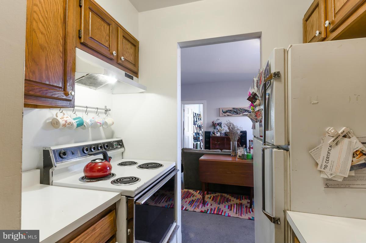2008 16th Street Northwest, Unit 302 Washington, DC 20009 - Photo 6 of 11 a room that has a couch and a stove in it