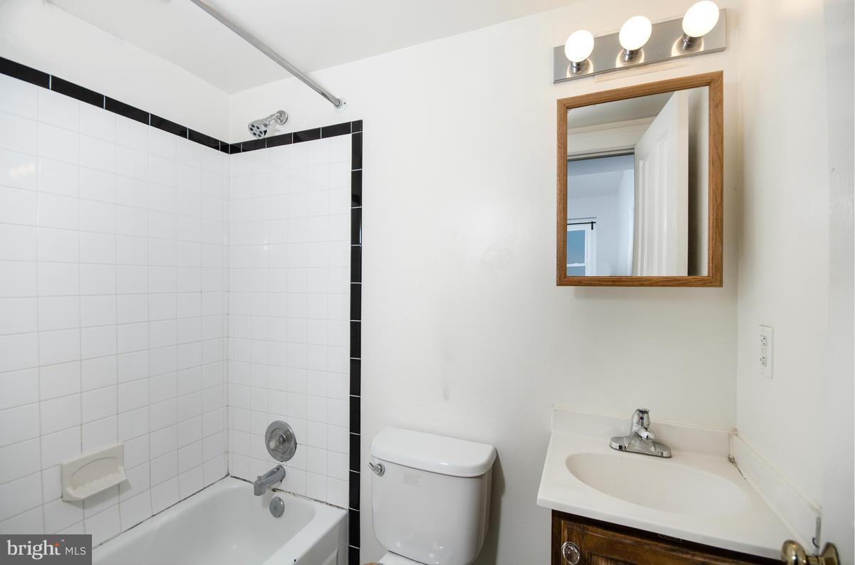 2008 16th Street Northwest, Unit 302 Washington, DC 20009 - Photo 10 of 11 a bathroom with a sink a toilet and shower