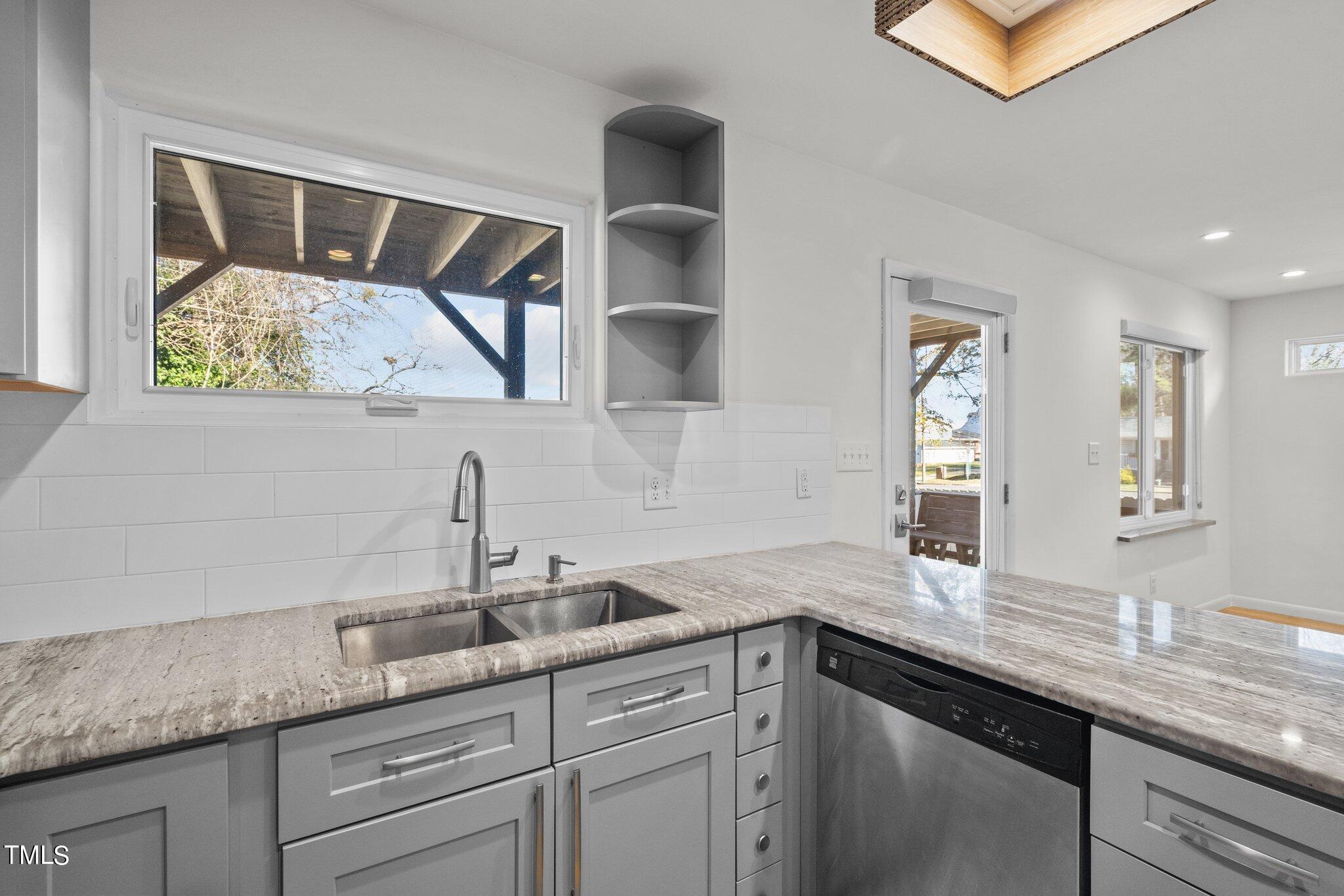 1427 East Lane Street Raleigh, NC 27610 - Photo 10 of 53 Kitchen has window and farmer style sink
