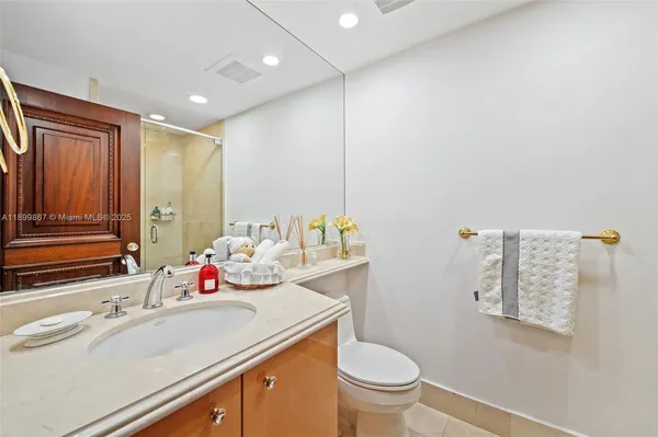 a bathroom with a sink toilet and vanity