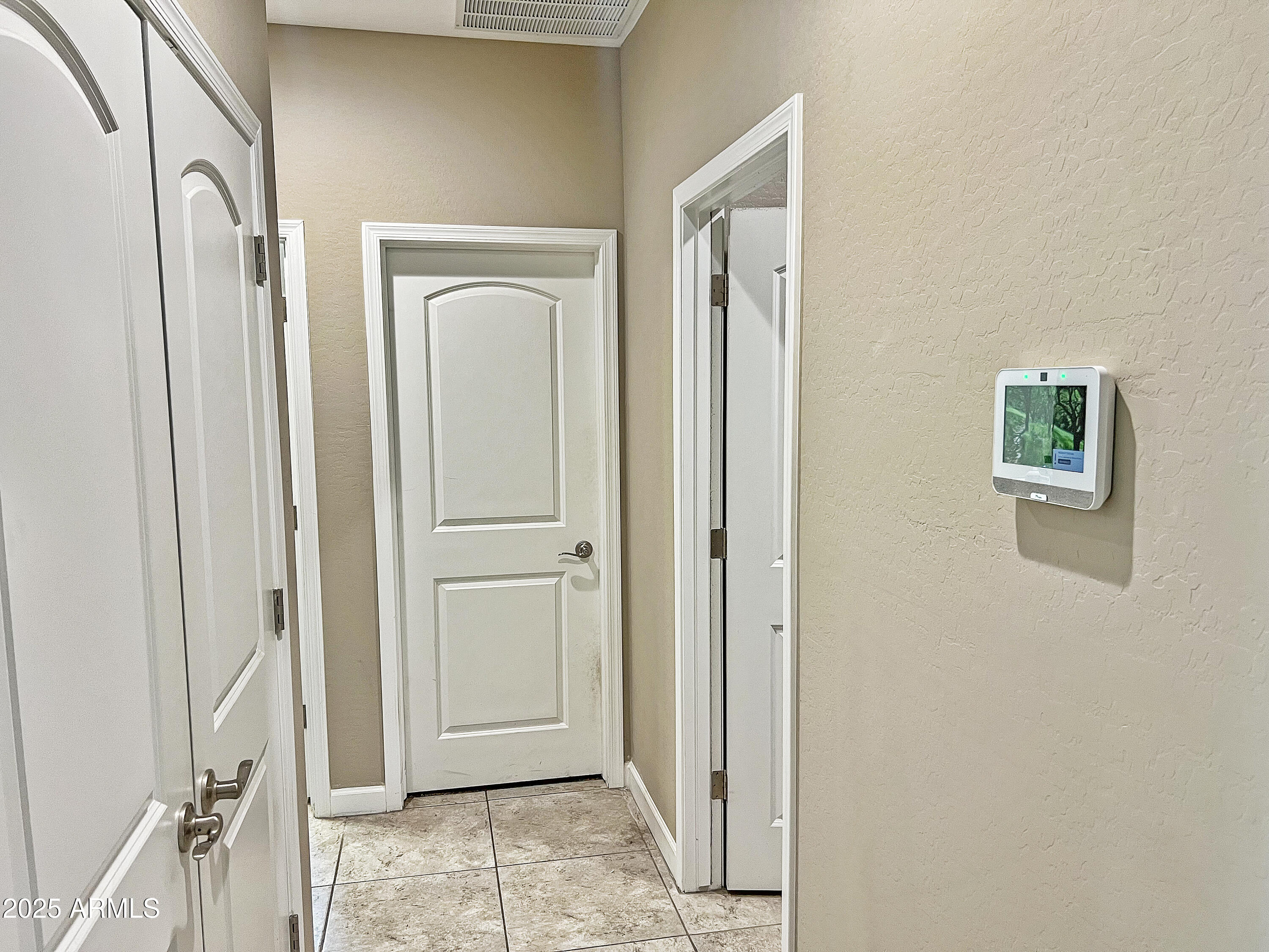 8491 West Springfield Way Florence, AZ 85132 - Photo 26 of 34 a view of a hallway with wooden floor and closet