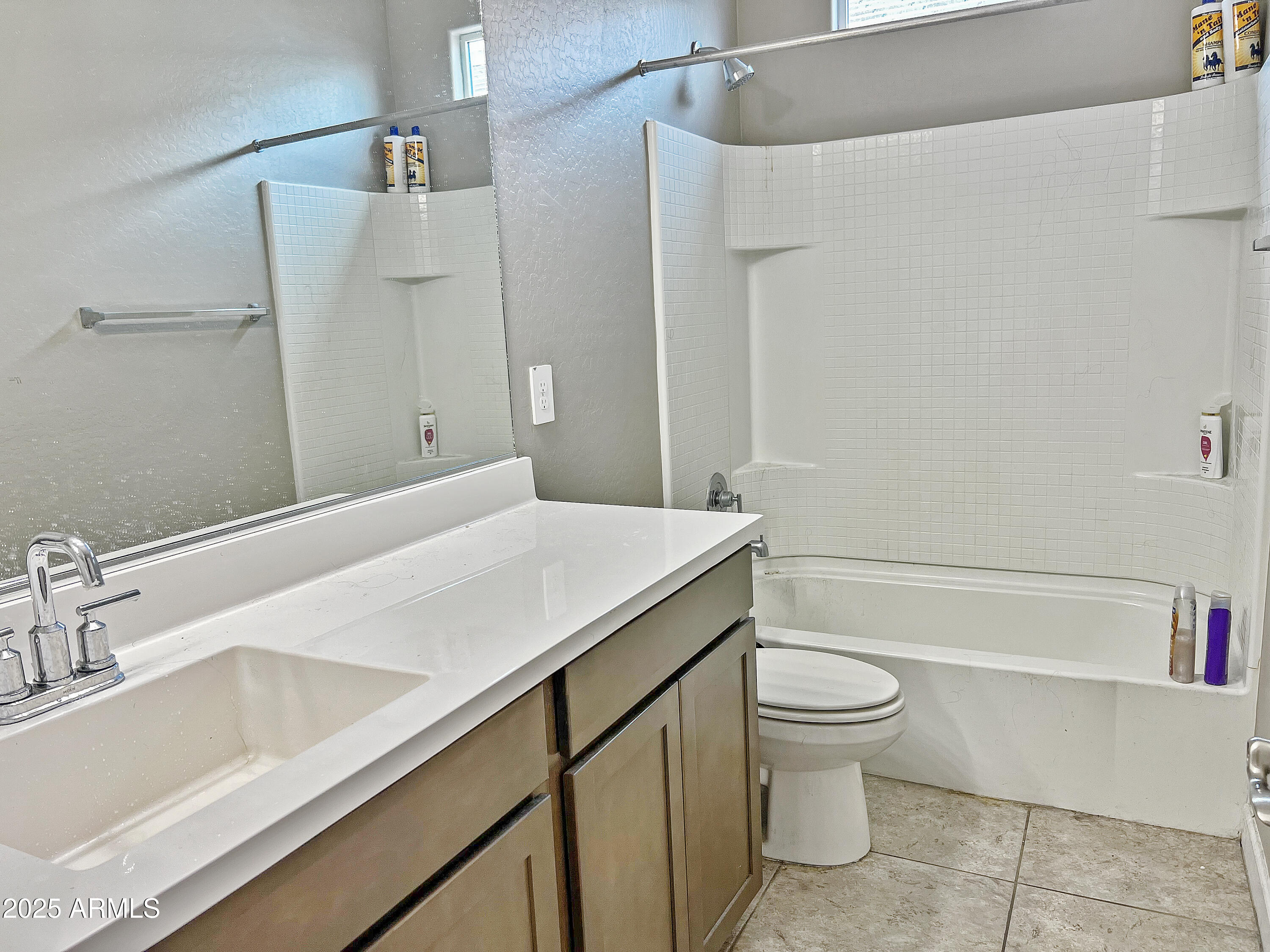 8491 West Springfield Way Florence, AZ 85132 - Photo 28 of 34 a bathroom with a granite countertop sink toilet and shower