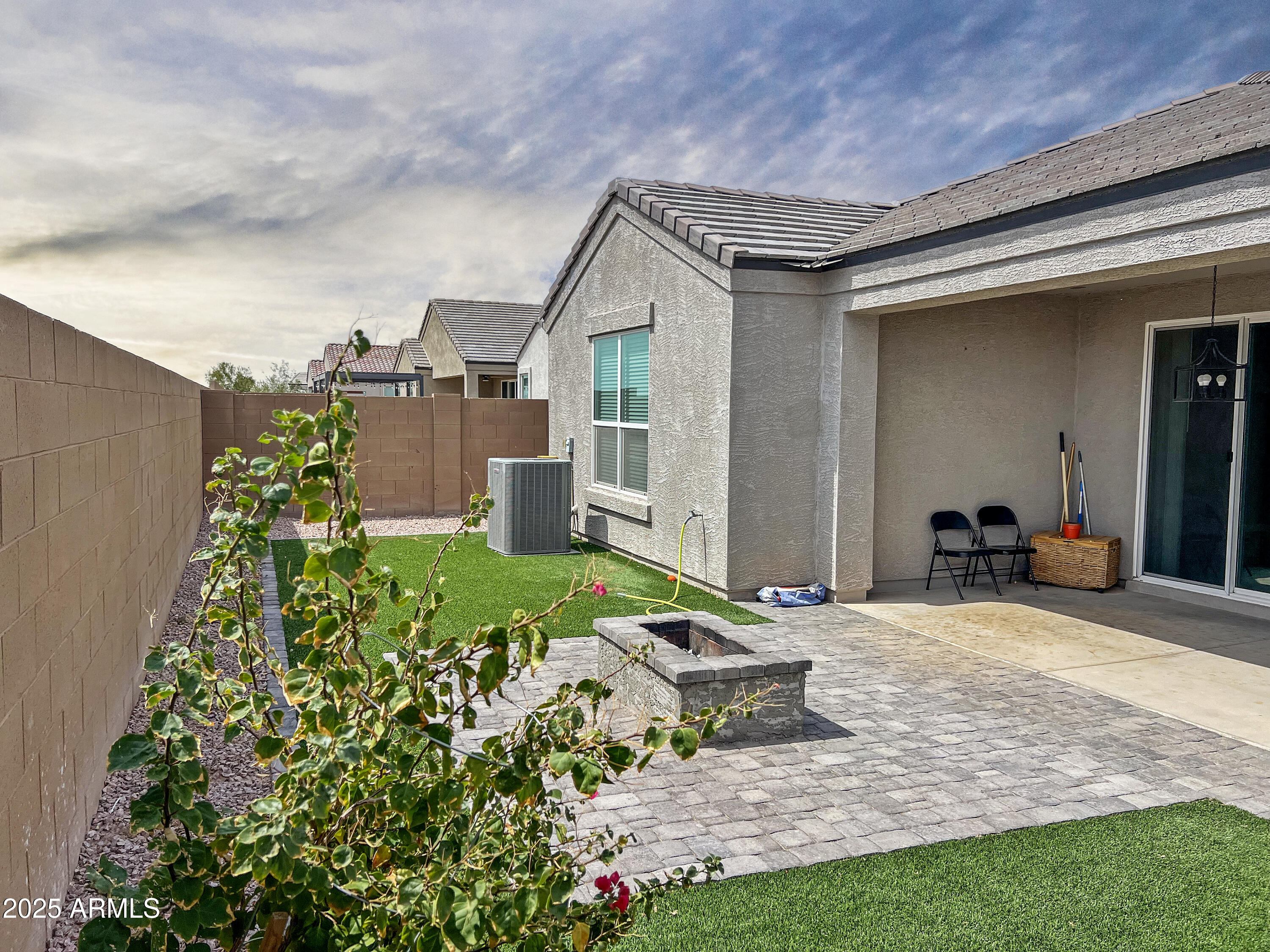 8491 West Springfield Way Florence, AZ 85132 - Photo 3 of 34 a front view of a house with a yard