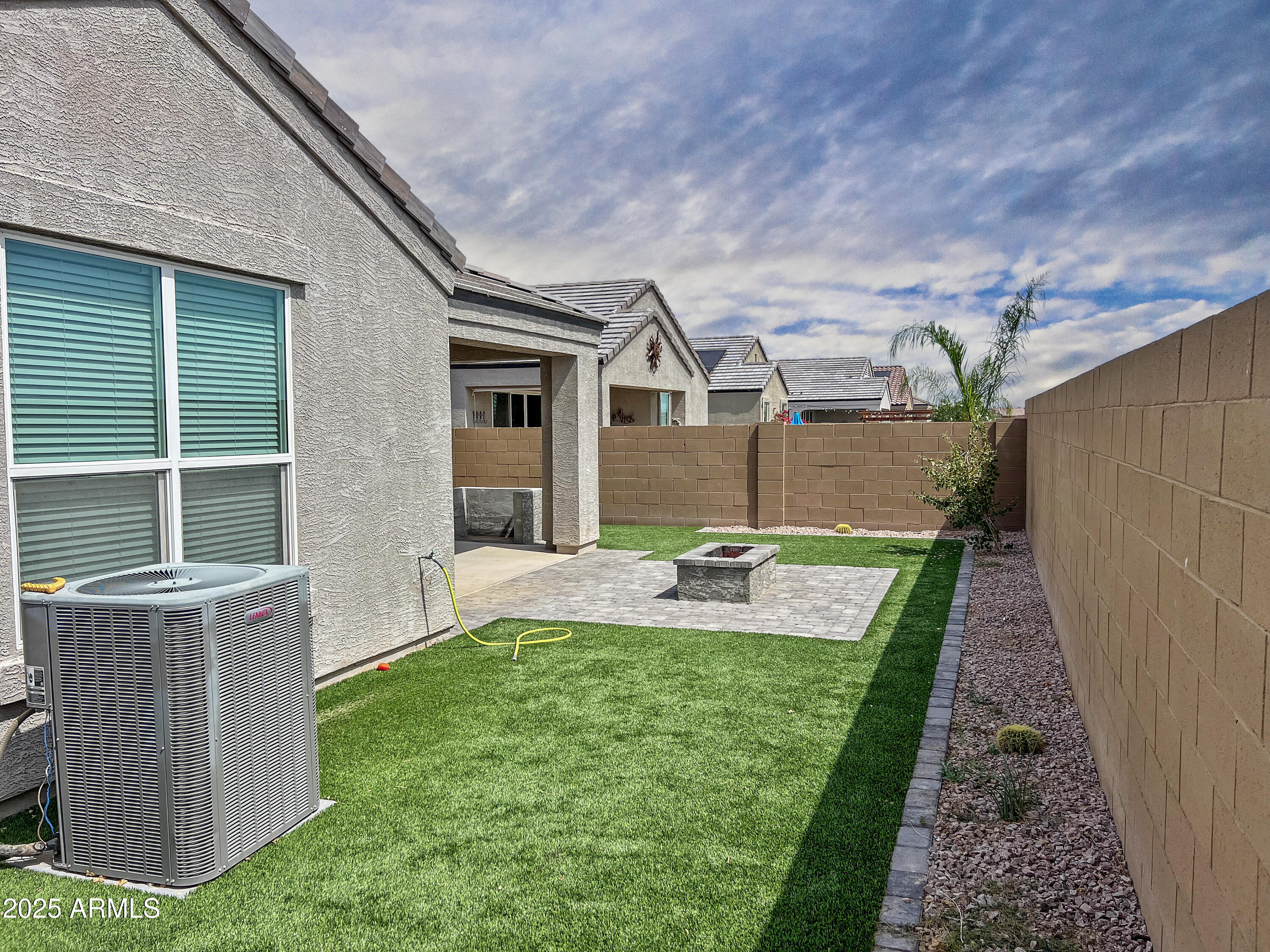 8491 West Springfield Way Florence, AZ 85132 - Photo 5 of 34 a view of an house with backyard space and sitting area