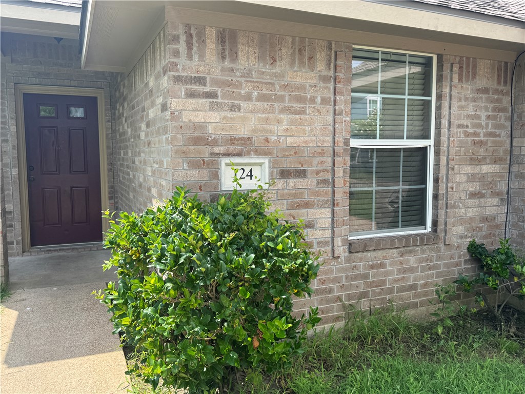 124 Sterling Street College Station, TX 77840 - Photo 2 of 13 a stone house with a outdoor space