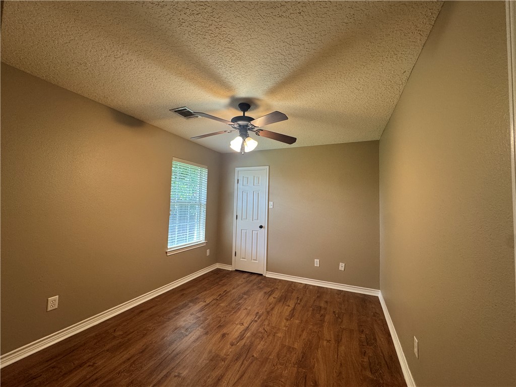 124 Sterling Street College Station, TX 77840 - Photo 5 of 13 a view of a livingroom with a ceiling fan and window