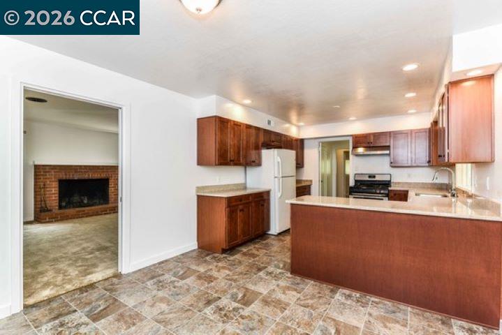 2648 Reliez Valley Road Martinez, CA 94553 - Photo 11 of 38 a kitchen with stainless steel appliances a refrigerator and a stove top oven