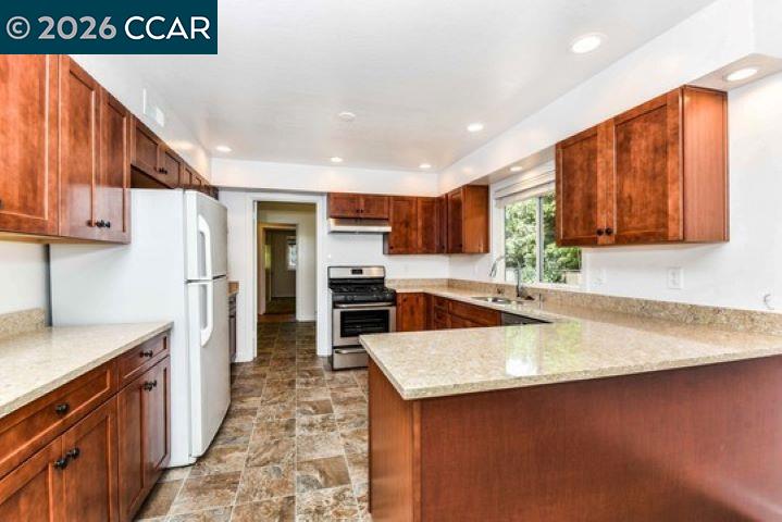 2648 Reliez Valley Road Martinez, CA 94553 - Photo 13 of 38 a kitchen with stainless steel appliances granite countertop a sink refrigerator and cabinets