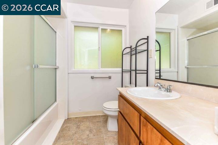 2648 Reliez Valley Road Martinez, CA 94553 - Photo 16 of 38 a bathroom with a sink a toilet and vanity