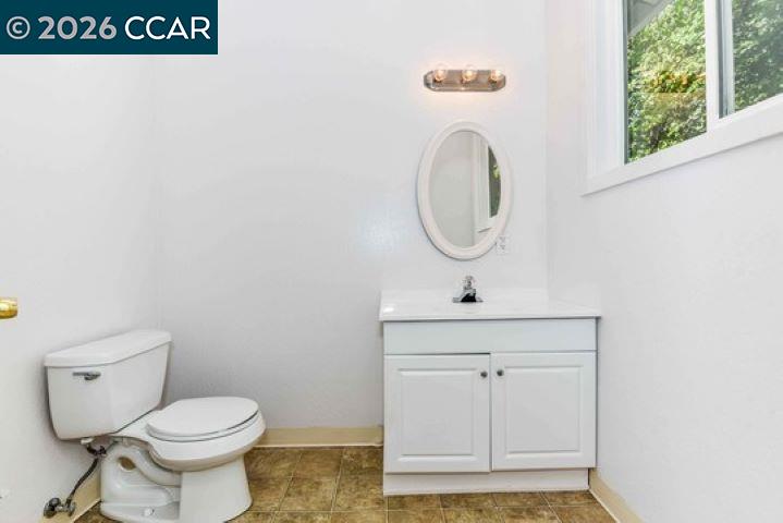 2648 Reliez Valley Road Martinez, CA 94553 - Photo 24 of 38 a bathroom with a toilet a sink and a window