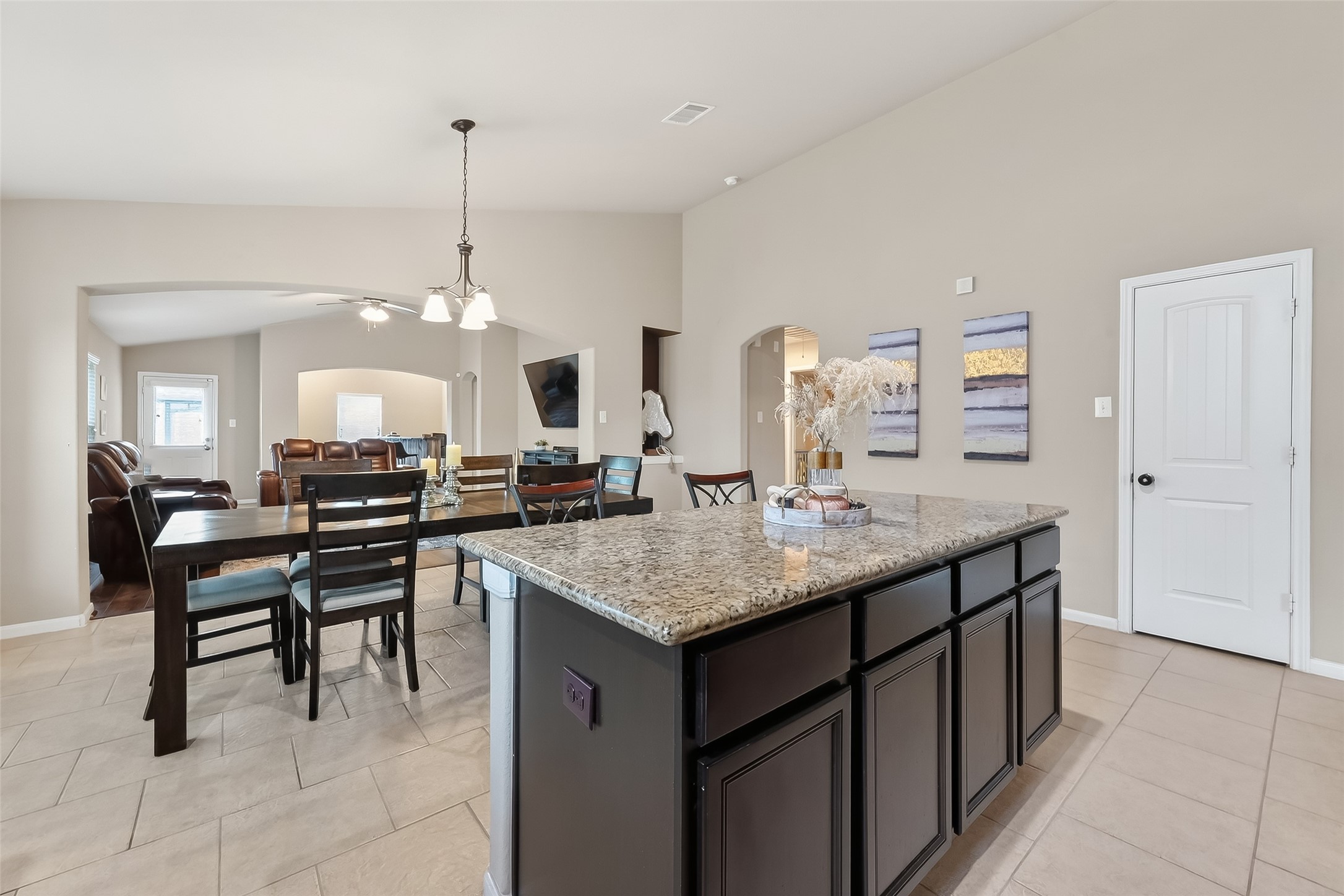 5919 Micah Lane Rosenberg, TX 77471 - Photo 12 of 39 Kitchen and dining area with a central island and open layout, offering a smooth flow and a bright, welcoming feel