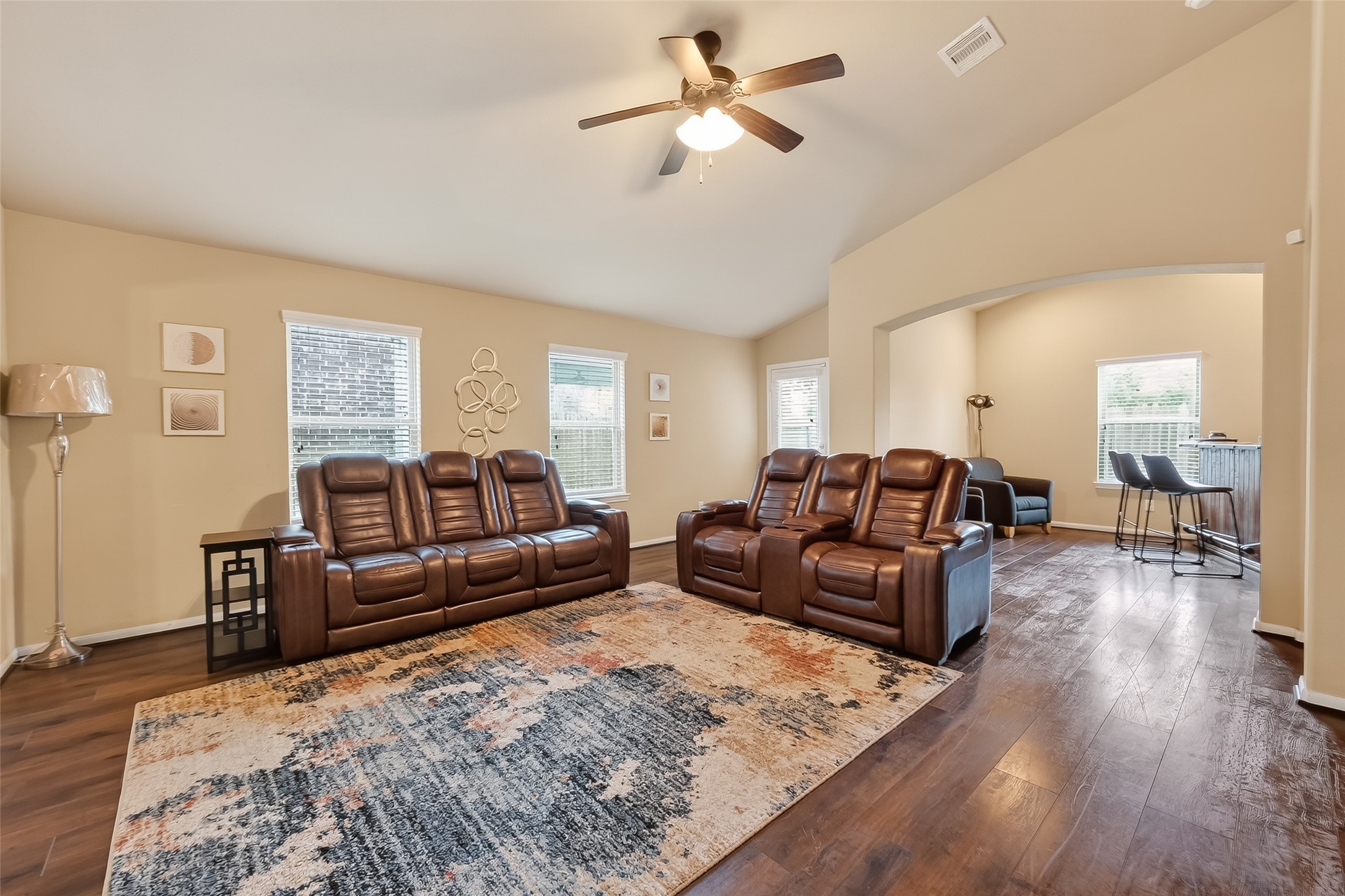 5919 Micah Lane Rosenberg, TX 77471 - Photo 20 of 39 Spacious living area with high ceilings and multiple windows that fill the room with natural light