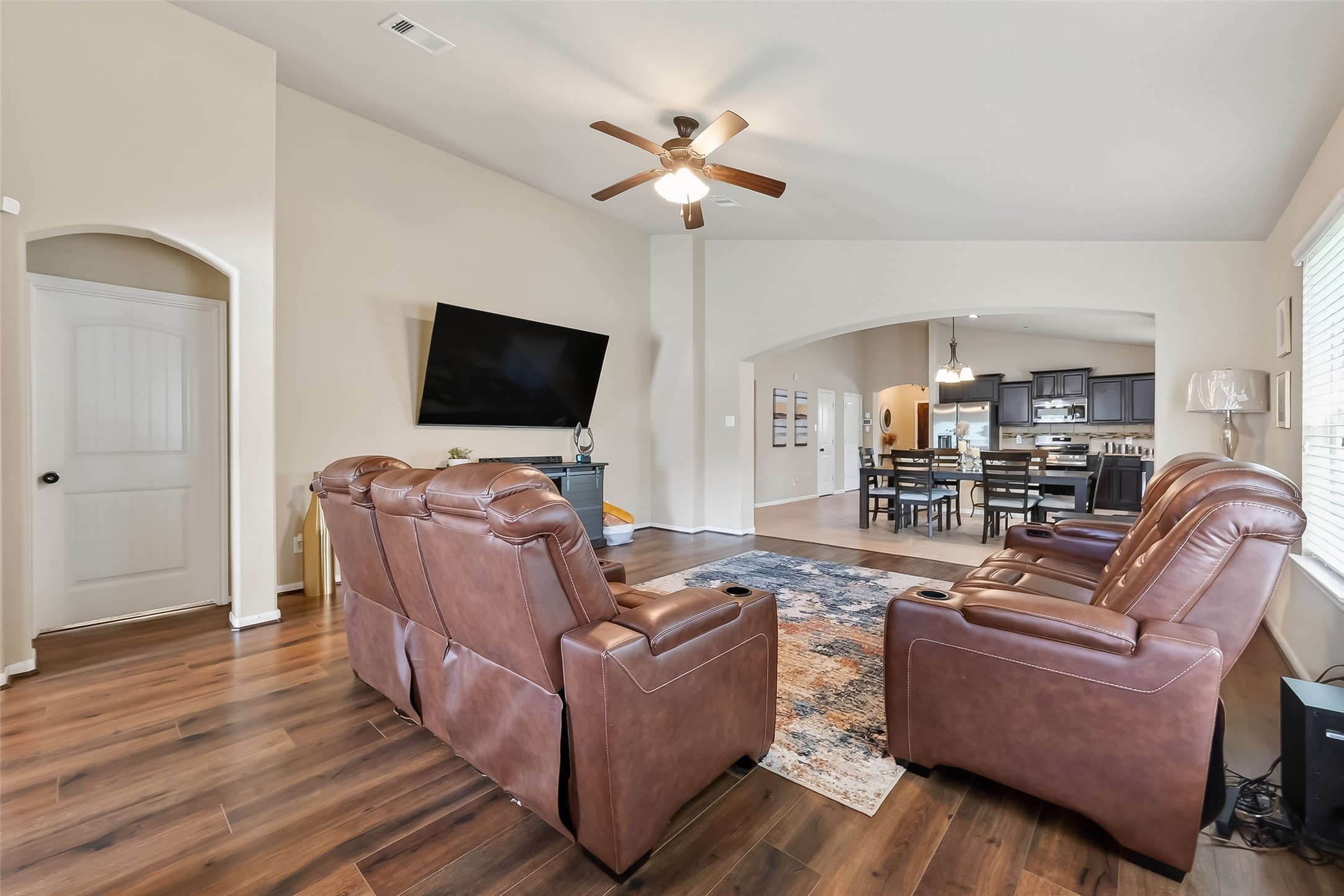 5919 Micah Lane Rosenberg, TX 77471 - Photo 21 of 39 Open living space with high ceilings and well-placed windows, connecting smoothly to the dining and kitchen areas for an easy flow