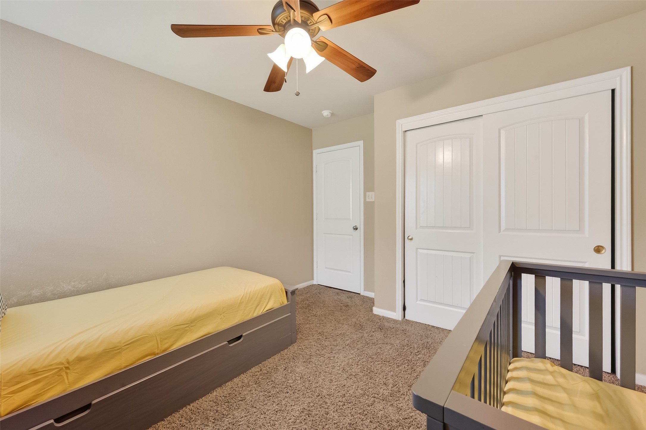 5919 Micah Lane Rosenberg, TX 77471 - Photo 33 of 39 This bright room features a large double-door closet, perfect for keeping everything tucked away and organized. The neutral walls and plush carpet create a calm, open feel that's ready for any decor