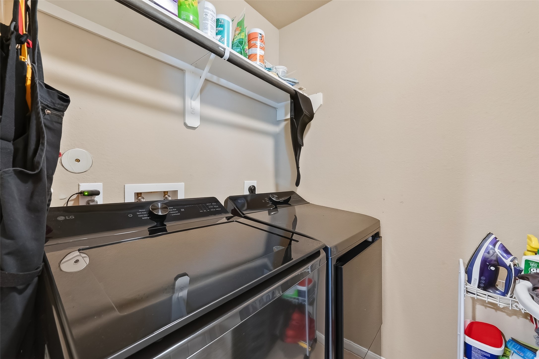 5919 Micah Lane Rosenberg, TX 77471 - Photo 35 of 39 This laundry room maximizes every inch, offering extra room for storage. It’s a tucked-away, functional spot that helps keep the rest of the home clutter-free