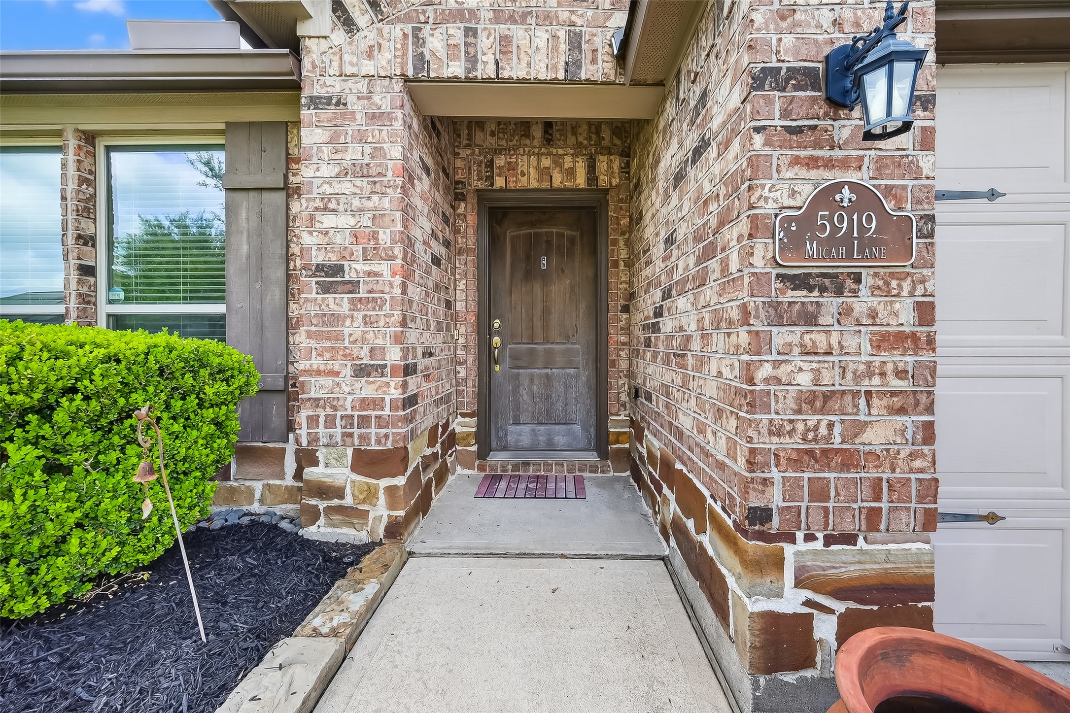 5919 Micah Lane Rosenberg, TX 77471 - Photo 4 of 39 Covered entry with brick detail and welcoming walkway