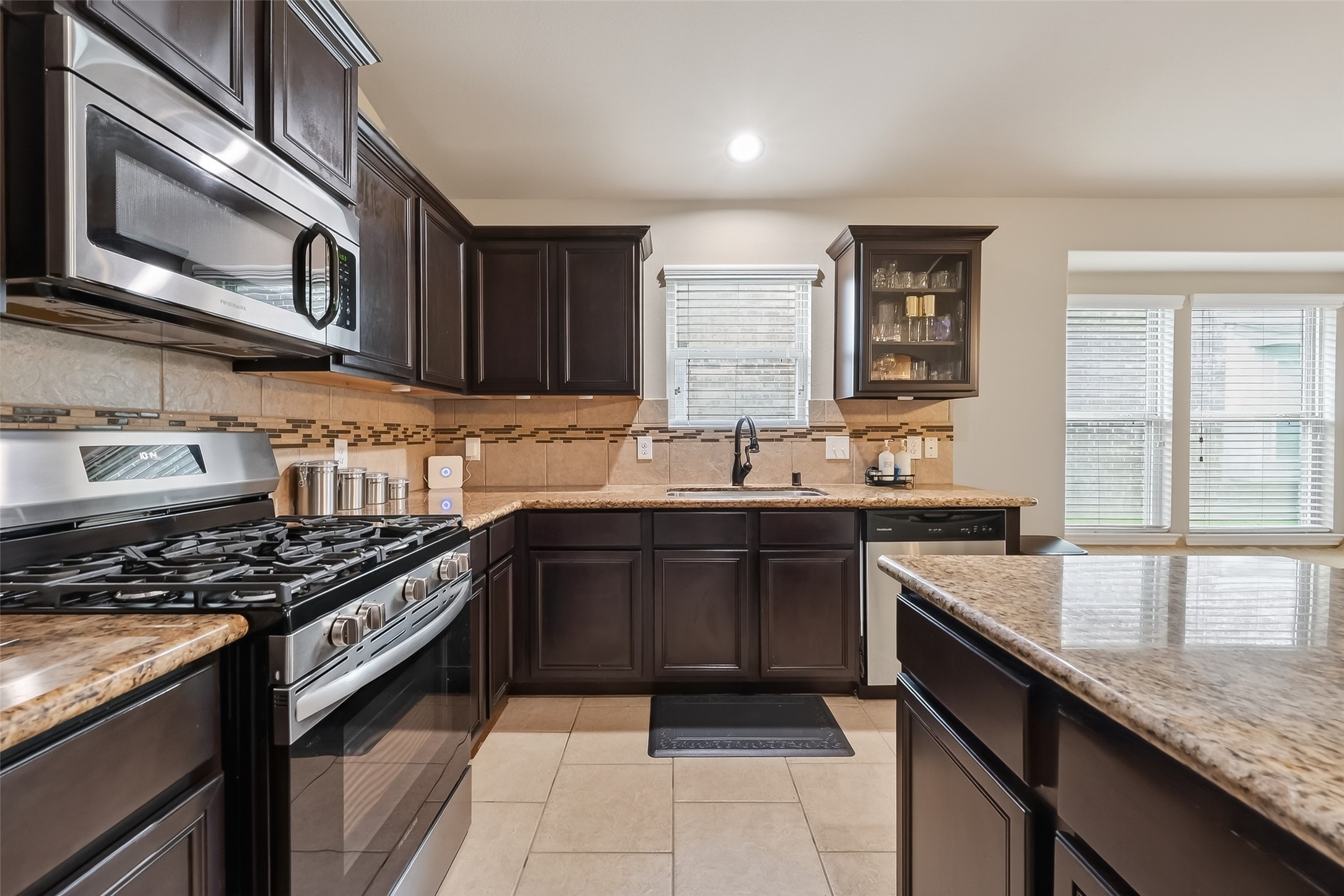 5919 Micah Lane Rosenberg, TX 77471 - Photo 9 of 39 Kitchen with stainless steel appliances and ample counter and cabinet space
