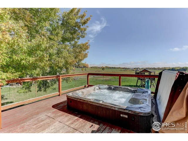 a view of a backyard with sitting area