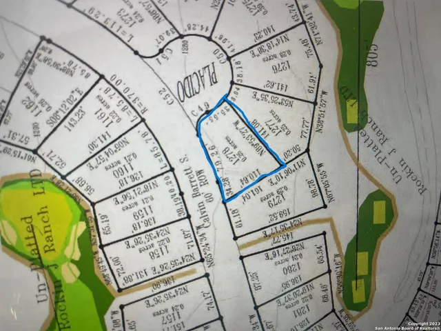 a view of a lake with a yard