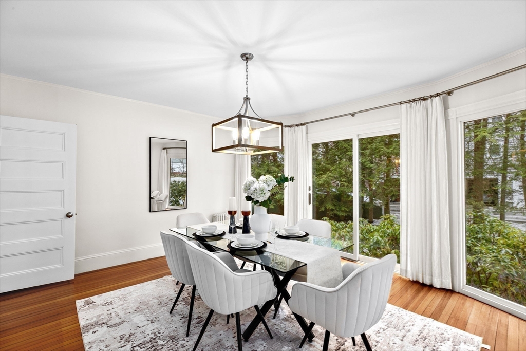 90 Brook Street Wellesley, MA 02482 - Photo 14 of 40 a dining room with furniture a chandelier and wooden floor