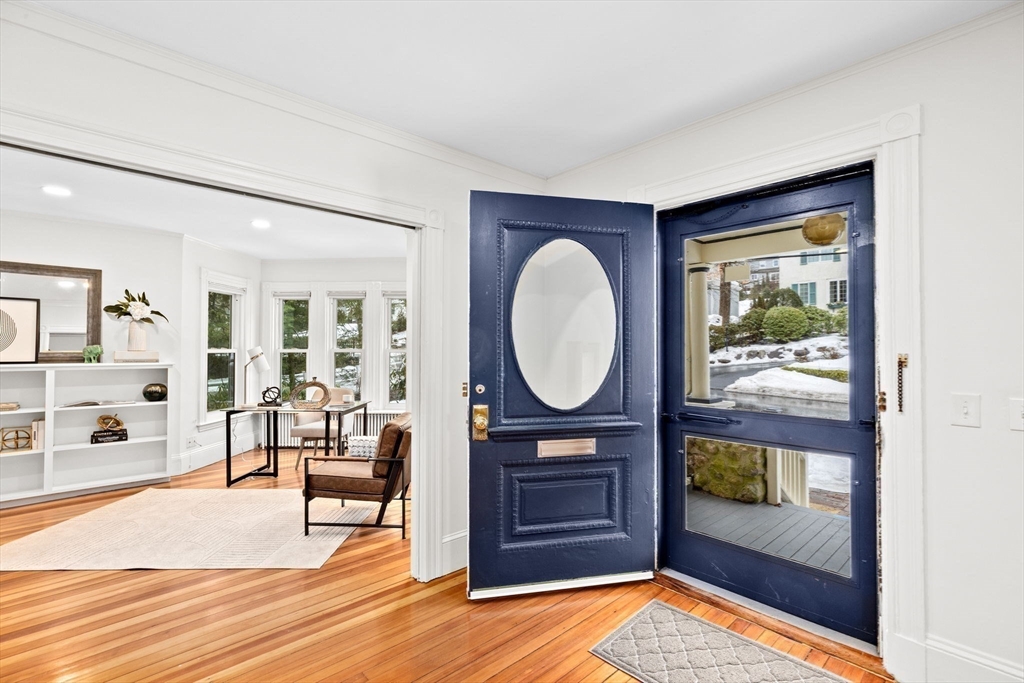 90 Brook Street Wellesley, MA 02482 - Photo 18 of 40 a living room with furniture a rug and a fireplace